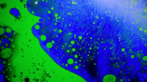 Amazing abstract liquid dye pattern green and blue dye Stock Footage 124420740