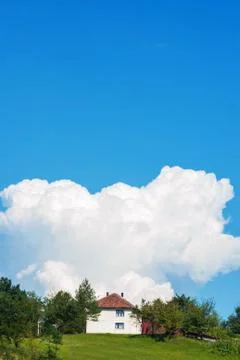 Amazing abstract white background clouds above family home Stock Photos