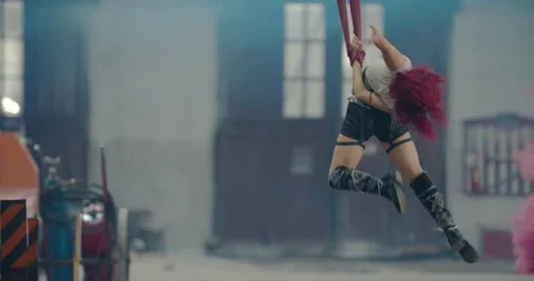 Amazing acrobatic tricks by a young redhead woman, 4k Stock Footage 139609349
