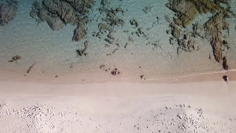 Amazing Aerial view of a Beach with flat rocks in the backdrop Stock-Footage 101425424