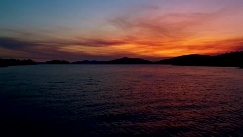 Amazing aerial view of dramatic sunset above the water Stock Footage 149009557