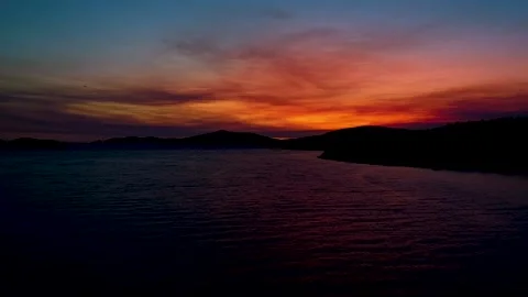 Amazing aerial view of dramatic sunset above the water Stock Footage 149009581