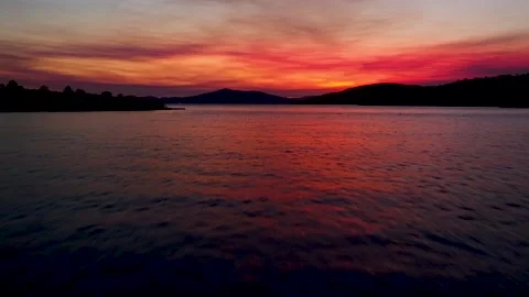 Amazing aerial view of dramatic sunset above the water Stock Footage 149009594