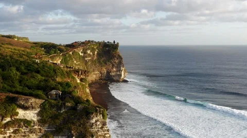 Amazing aerial view of high cliffs above blue ocean. Silhouette of Uluwatu Stock Footage 121923297