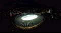 Amazing aerial view of sports arena ready for championship, night cityscape 4k or 4k+ Resolution