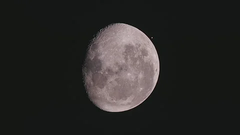 An amazing astronomical event, Moon surface covers planet Mars awe night sky Video stock 148180585