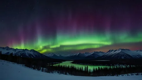 Amazing aurora borealis dancing in the night sky over snowy mountains and lake. Stock Footage 296664703
