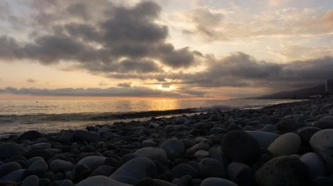 Amazing beach sunset over Black Sea. Lazarevskoye, Sochi, Russia Stock Illustration