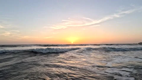 Amazing beach at sunset with waves in the ocean at the beach in the evening Stock Footage 237164187