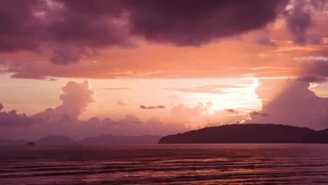 Amazing beam light sunset on the beach and sky under dense clouds Stock Footage 153507267