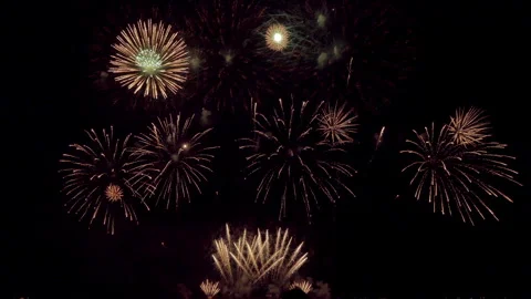 Amazing beautiful colorful firework display over sea on celebration night Stock Footage 252443053