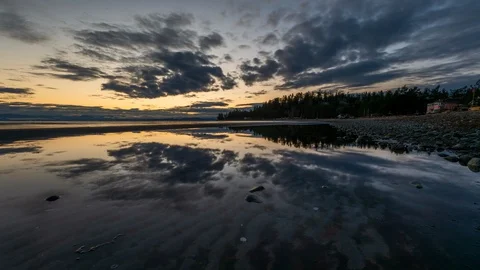 Amazing beautiful sunrise reflection time lapse with dramatic clouds moving Stock Footage