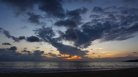 Amazing beautiful sunset reflection on the sea with rock, wave and mountain Video stock 99068030