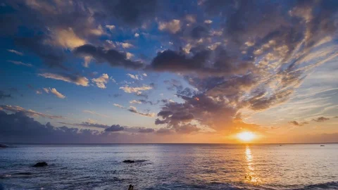Amazing beautiful sunset reflection on the sea with rock, wave and mountain Stock-Footage 100737380