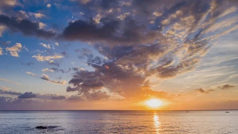 Amazing beautiful sunset reflection on the sea with rock, wave and mountain Stock-Footage 100737395