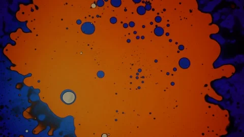 Amazing blue and orange pattern made of water and oil Stock Footage 127714539