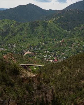Amazing bridge with mountains and trees in background during summer Photos