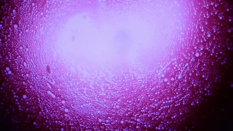Amazing bubbly cosmic shape spin violet liquid dye Stock Footage 127723266