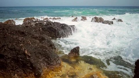 Amazing camera movement in slow motion of an azure sea water waves striking the Stock-Footage 108856251