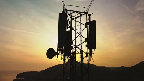 Amazing closeup sunset drone view of silhouette of cell tower Stock Footage 173856365