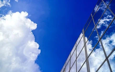 Amazing cloud and sky reflection on window glass building. Stock Photos