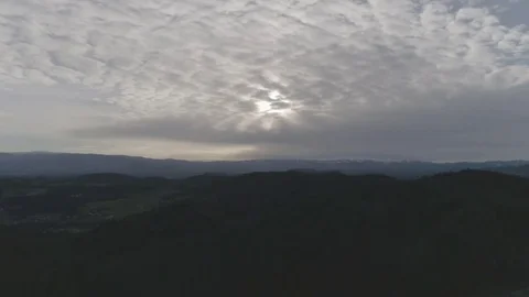 Amazing cloud formation in the sky over a green peaceful landscape, 4K Stock Footage 73844322