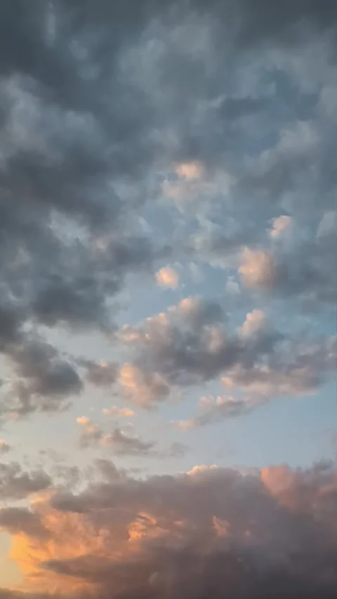 Amazing cloud time-lapse from day to twilight. Vertical Video Stock Footage 284327364