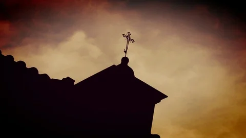Amazing clouds that flow behind the cross of a bell tower Stock Footage 89994437