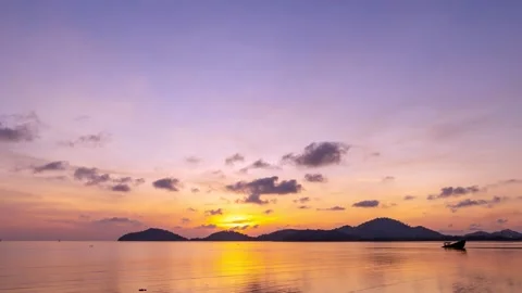 Amazing clouds over sea Timelapse, Sunset or sunrise Burning golden sky Stock Footage 154549119