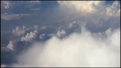 The amazing clouds panning from jet plane window in high definition. Stock Footage