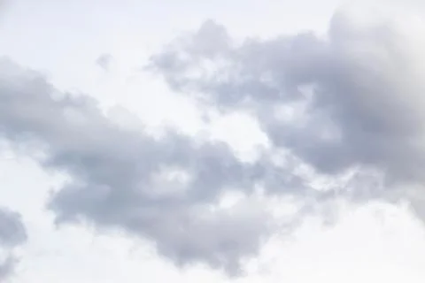 Amazing clouds in the sky. A beautiful clouds against the white sky backgroun Stock Photos