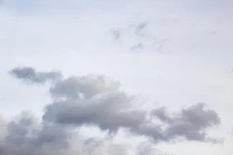 Amazing clouds in the sky. A beautiful clouds against the white sky backgroun Stock Photos