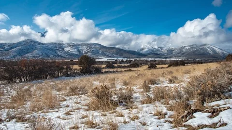Amazing cloudscape as the clouds react to the mountain peaks in the Video stock 122020997