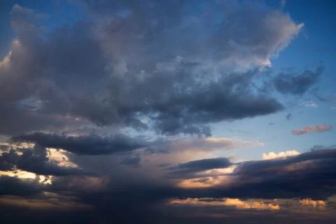 Amazing cloudscape on the sky at sunset time after rain. 写真素材