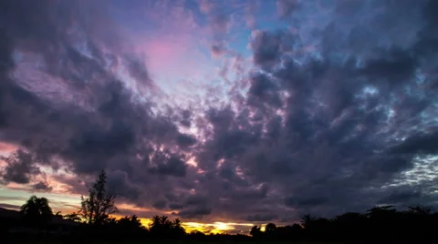 Amazing cloudy sunset time lapse with silhouettes of palm trees in the backgroun Stock Footage 50610417