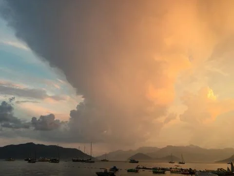 Amazing cloudy sunset: view of the touristic port during sunset with a cloudy Stock Photos