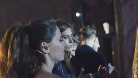 Amazing company of happy friends hang out at the concert Stock Footage