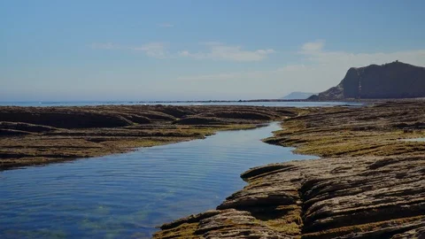 Amazing crane down shot of landscape by the sea Stock Footage 112294175