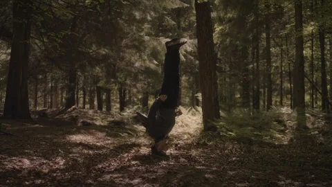 Amazing Dancer Does Headspin in Forest Slow Motion 4K Stock Footage 242762248
