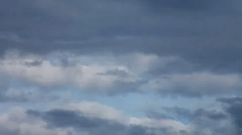Amazing dramatic gloomy view of the disappearing blue sky in low leaden clouds. Stock Footage 39652305