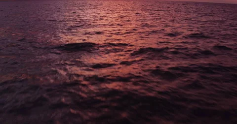 Amazing Dramatic Sunset View. 4K Aerial Shot Flying Low Over Ocean Video stock 57133723