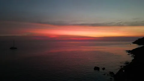 Amazing dramatic sunset view with sea, boat and sun on the horizon Stock Footage 234980236