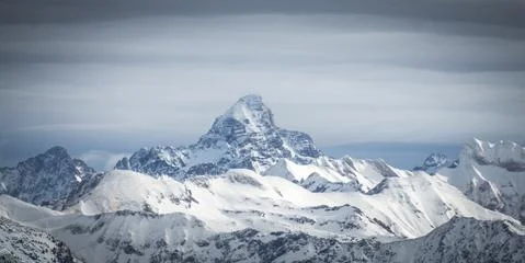 Amazing dramatic Winter panoramic View to the snow covered Mountain Hochvogel in Stock Photos