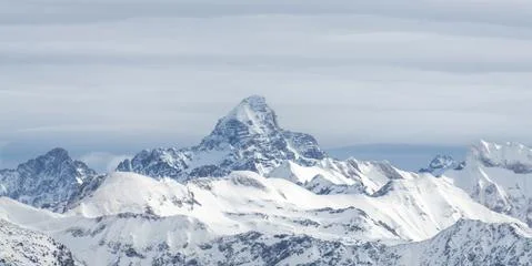 Amazing dramatic Winter panoramic View to the snow covered Mountain Hochvogel in Stock Photos
