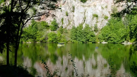 Amazing Drone Flight Right Above the Beautiful Lake in the Middle of Mountains Stock-Footage 129337676