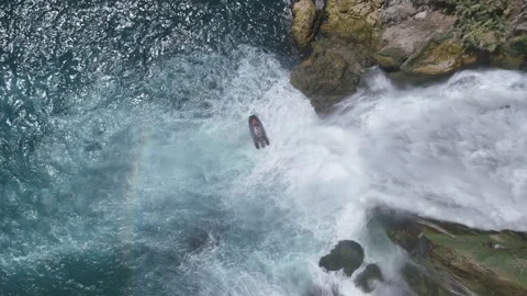 Amazing Düden Waterfall falling into Mediterranean sea with tour boats around Stock Footage 342949885