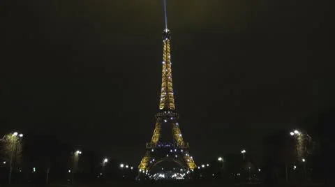 Amazing Eiffel Tower and Champ de Mars by night stars illuminated icon landmark Stock Footage
