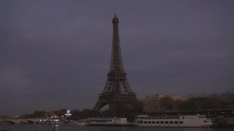 Amazing Eiffel Tower and Sena river by night paris twilight illuminated boats Stock Footage 10772237