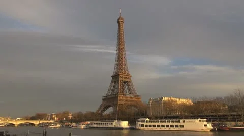 Amazing Eiffel Tower and Sena river paris twilight sunlight cloudy boats Stock Footage 10772495