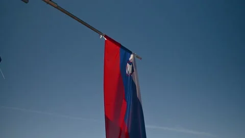 Amazing elevated viewpoint with flag of Slovenia waving in breeze Stock Footage 149010821